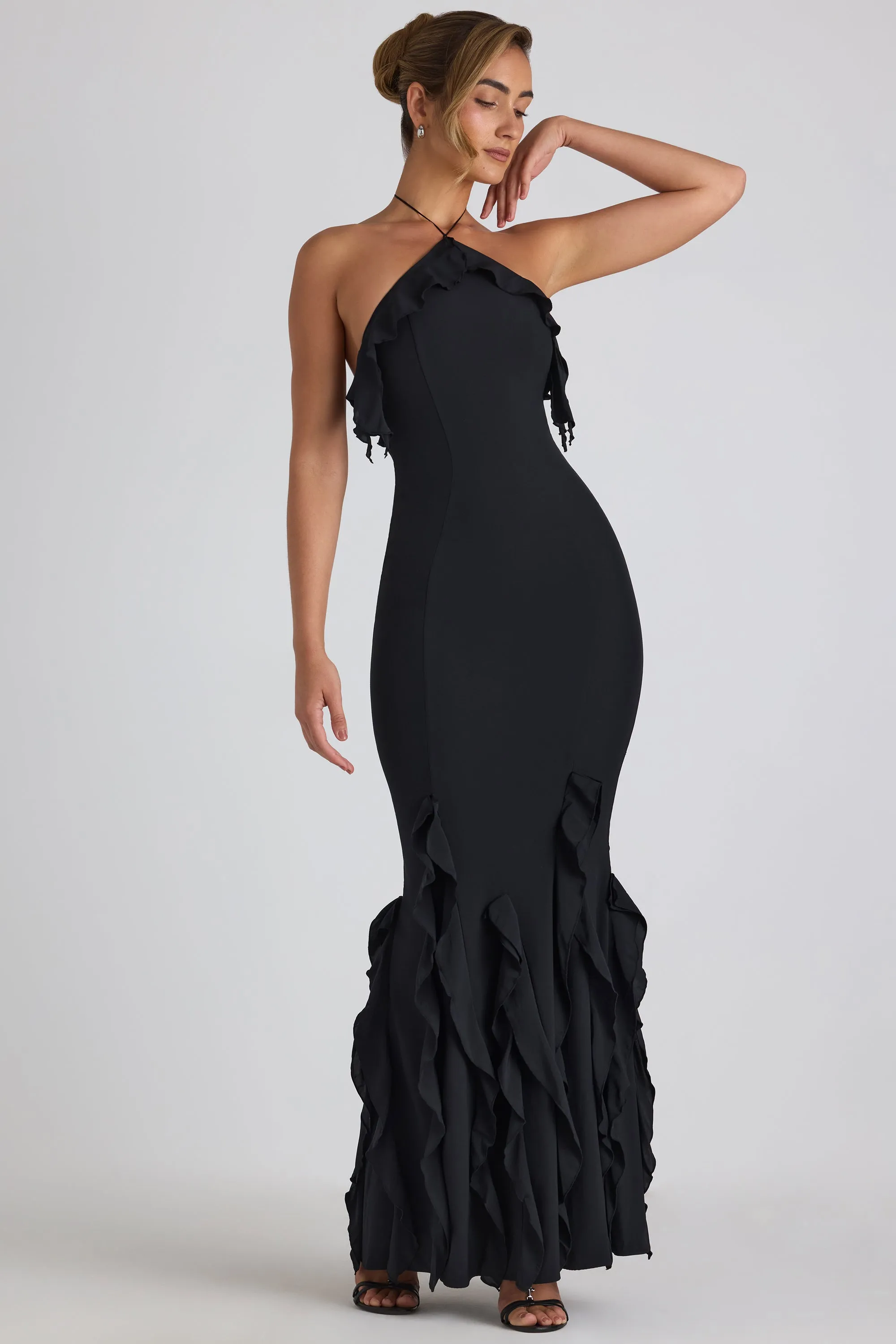 Ruffle-Trim Halterneck Gown in Black sold by Oh Polly