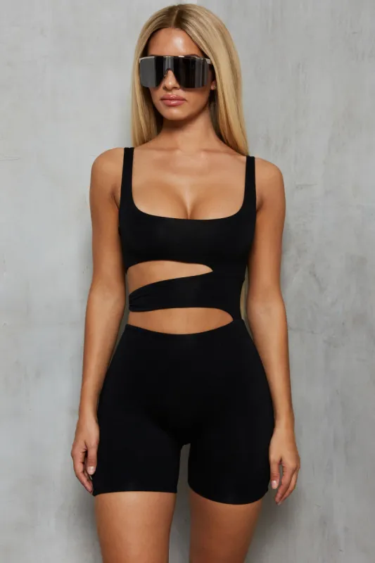 Play Hot & Cold Cut Out Playsuit in Black sold by Oh Polly