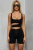 Play Hot & Cold Cut Out Playsuit in Black sold by Oh Polly