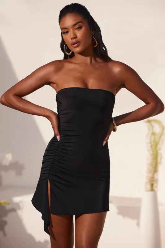 Bandeau Ruched Split Mini Dress in Black sold by Oh Polly