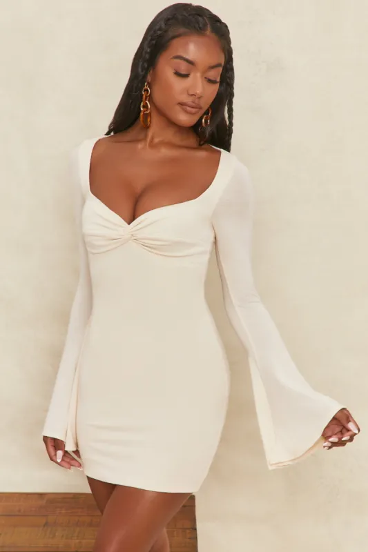 Flare Sleeve Mini Dress in Cream sold by Oh Polly
