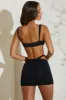 Asymmetric Twist Detail Mini Skirt in Black sold by Oh Polly