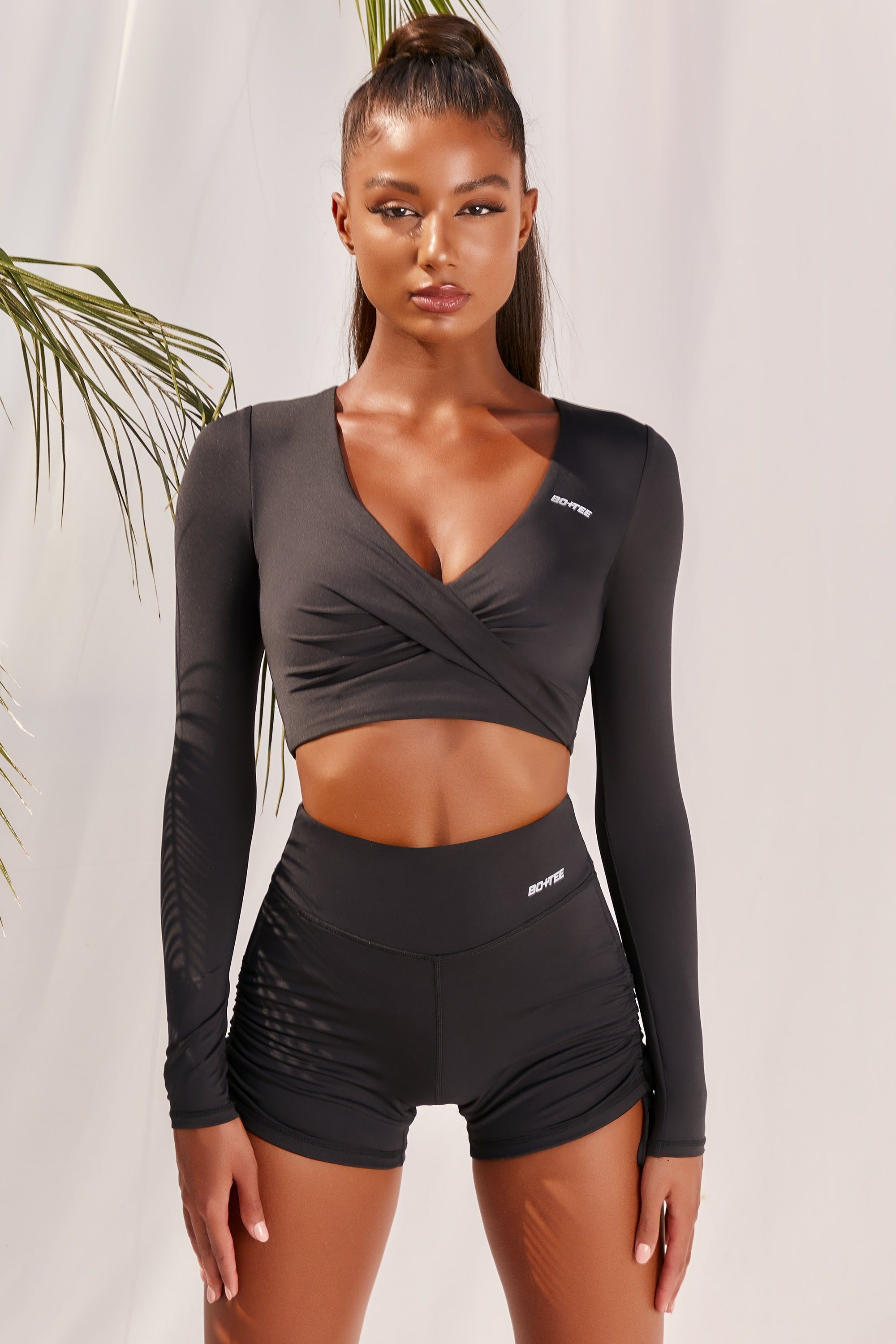 Progress Slinky Long Sleeve Crop Top in Black sold by Oh Polly