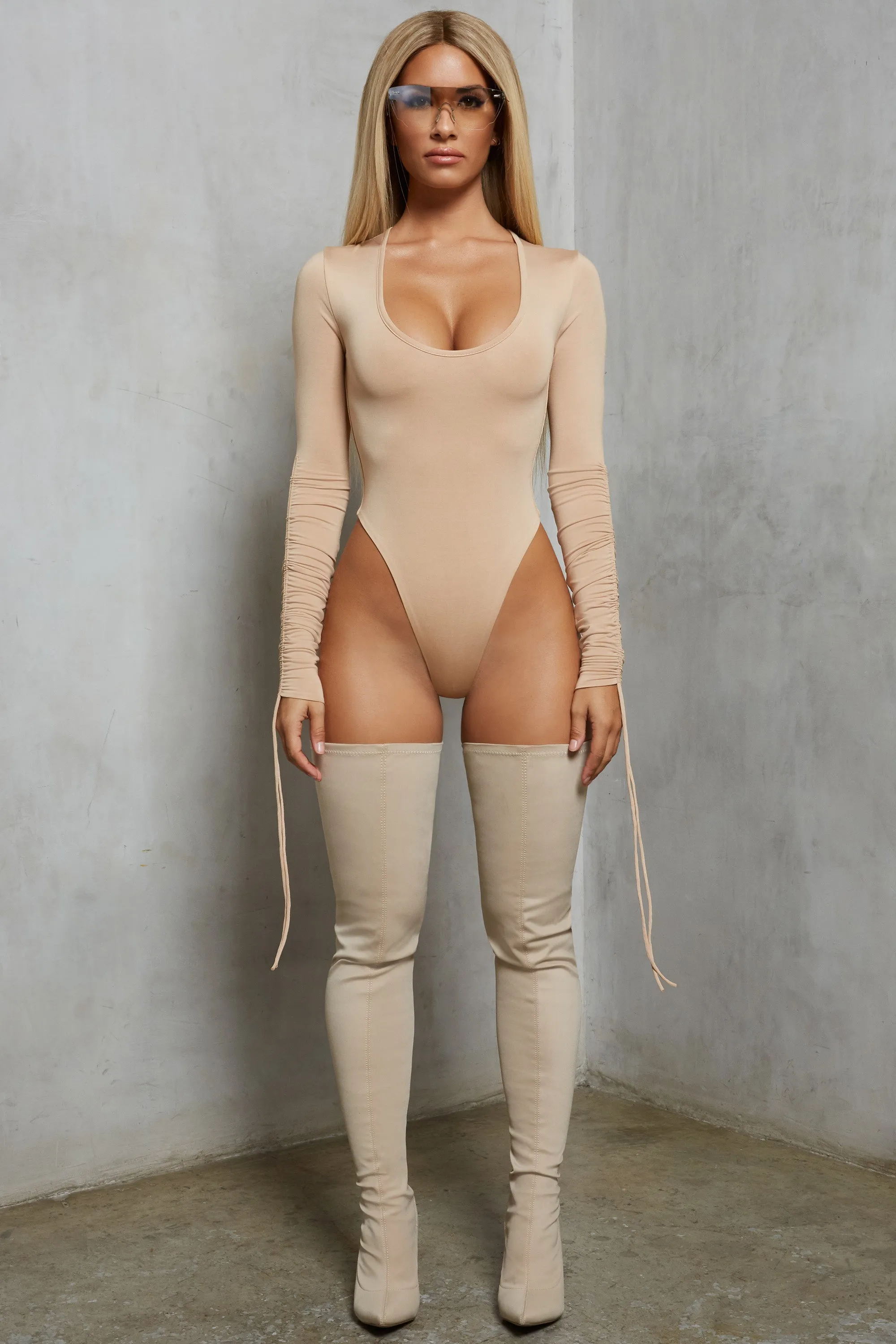 Sleeve A Message Ruched Long Sleeve Bodysuit in Beige sold by Oh Polly