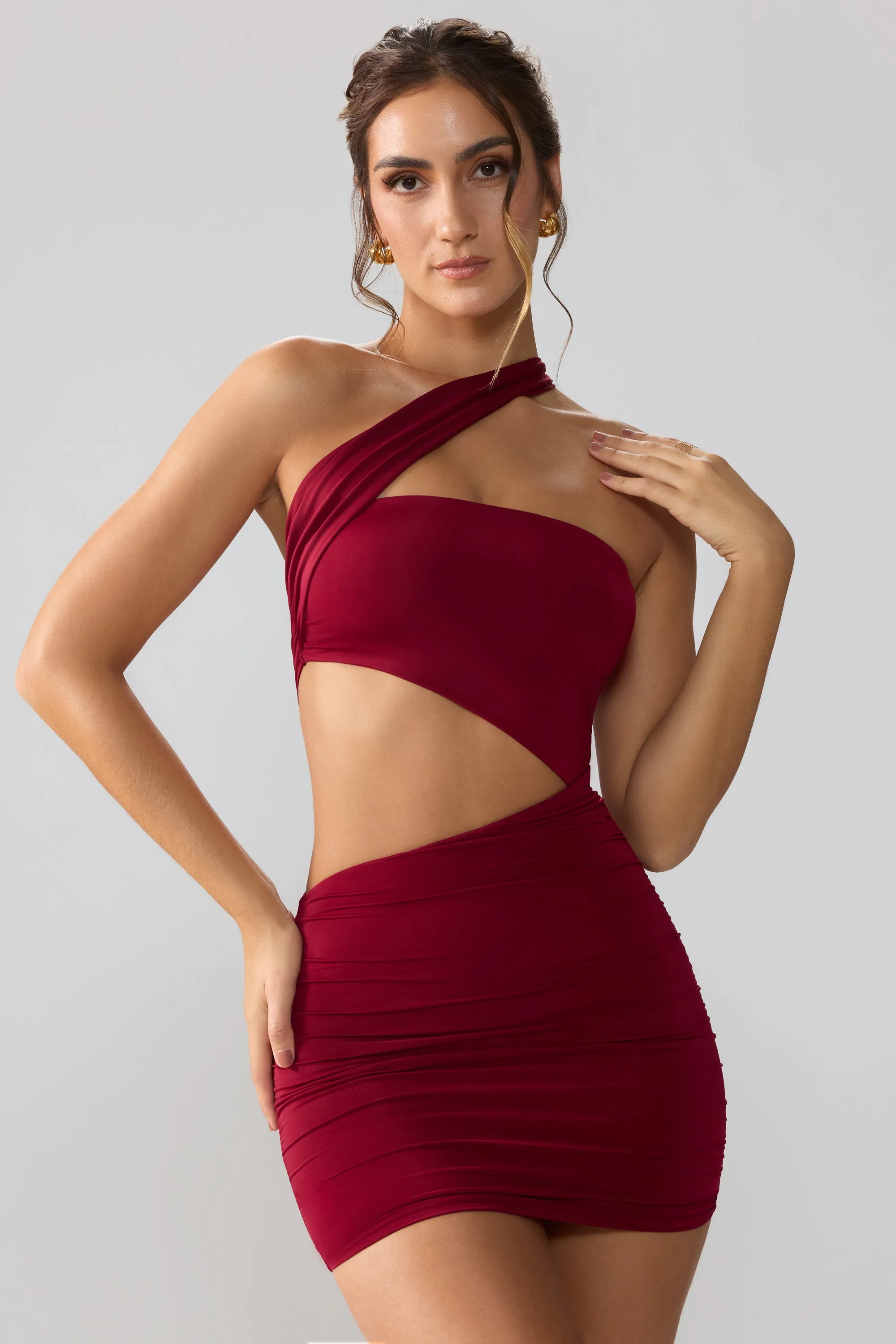 Slinky Jersey Ruched Cut Out Mini Dress in Ruby sold by Oh Polly