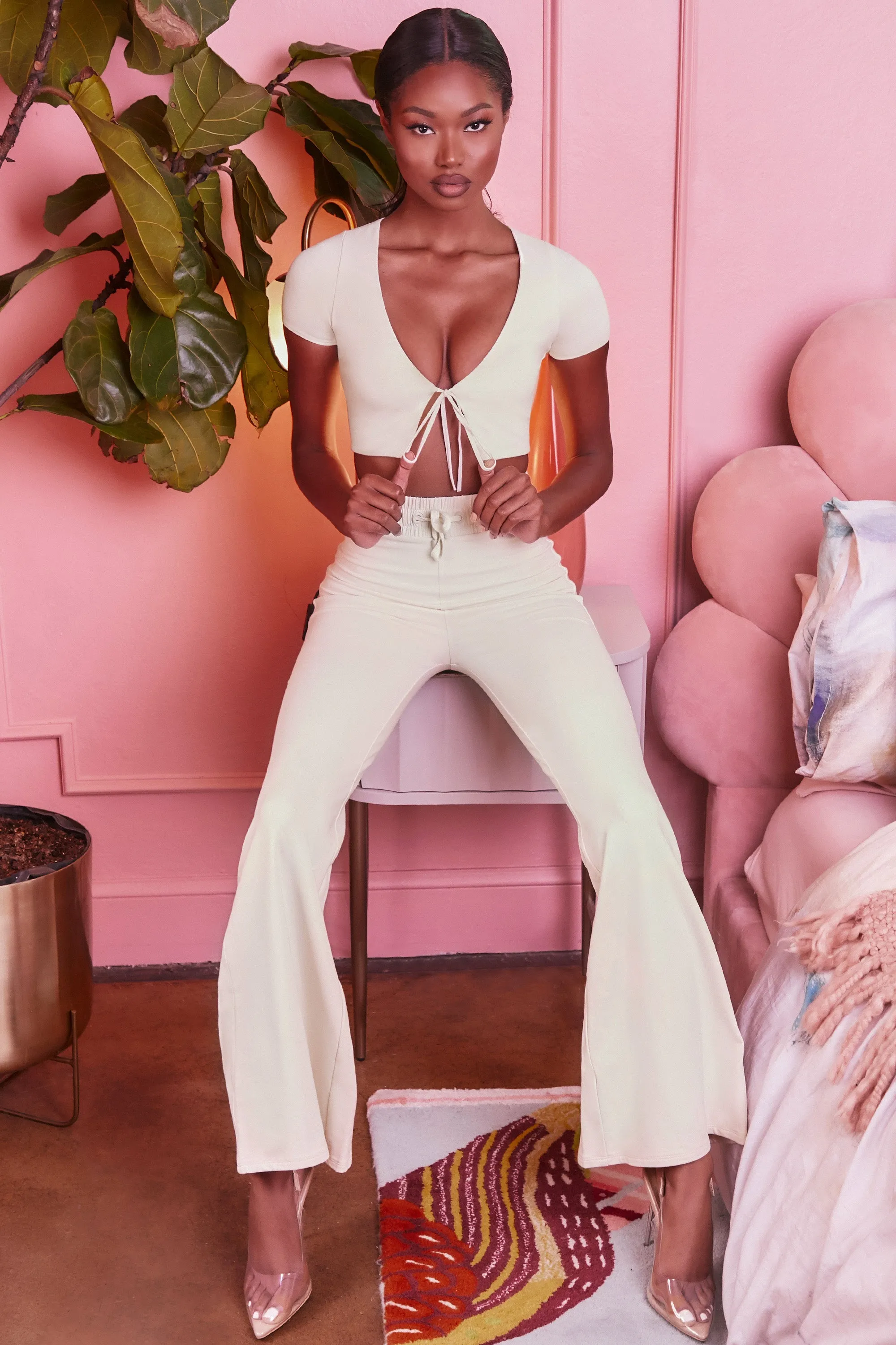 Laid Back Wide Leg Trousers in Cream sold by Oh Polly