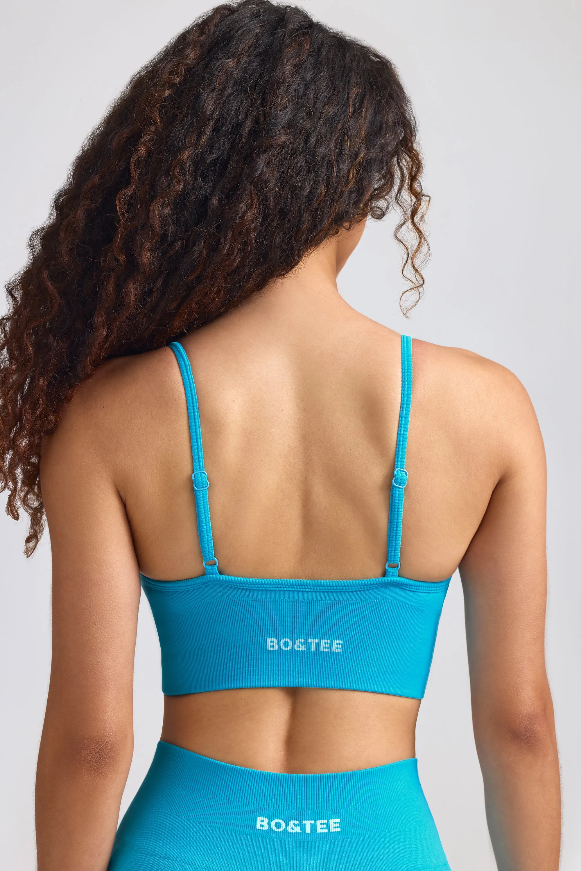 Define Luxe V-Neck Sports Bra in Turquoise Blue sold by Oh Polly product image thumbnail 2