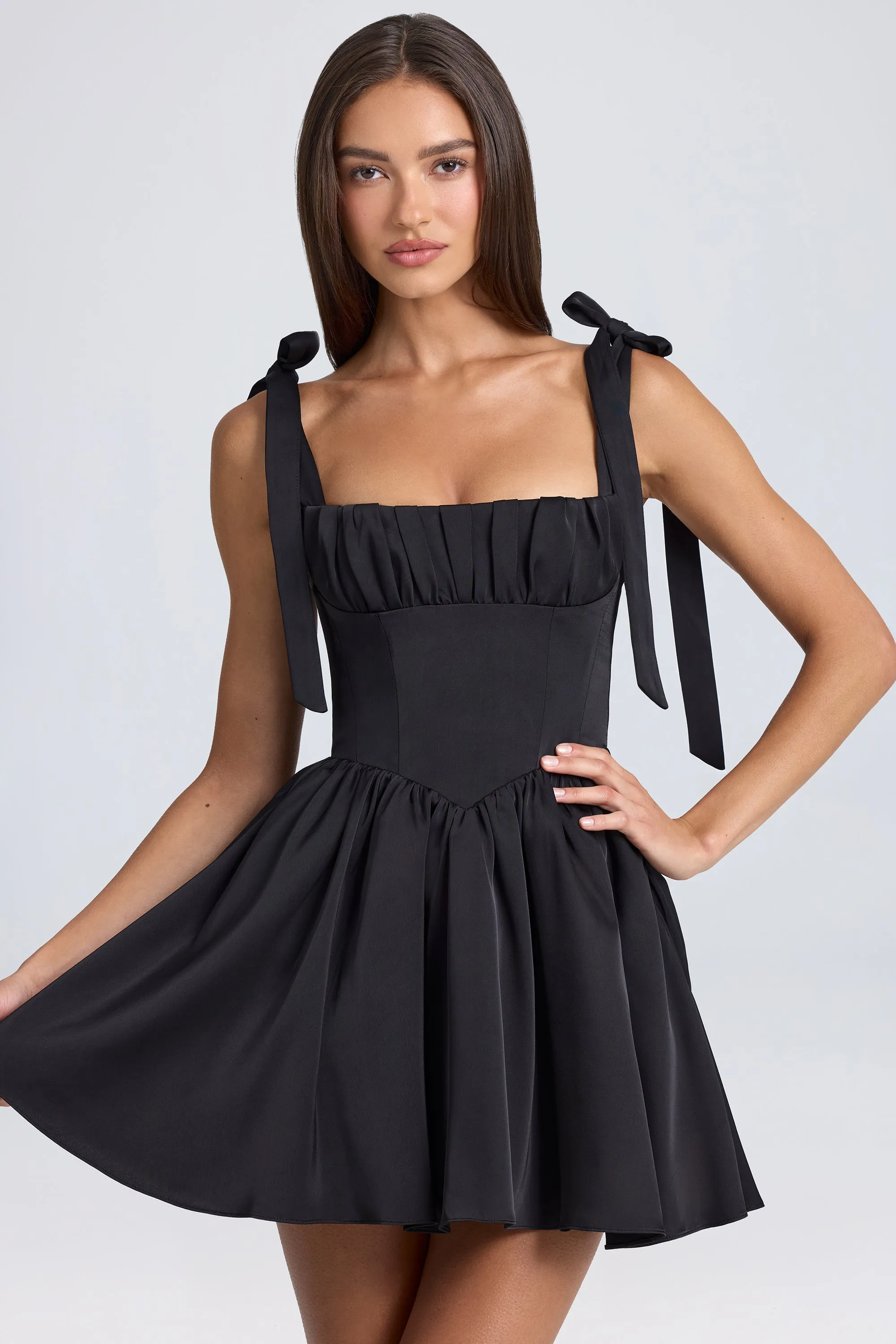 Draped Corset Mini Dress in Black sold by Oh Polly