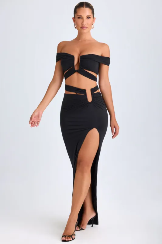 Asymmetric Cut-Out Maxi Skirt in Black made by Oh Polly