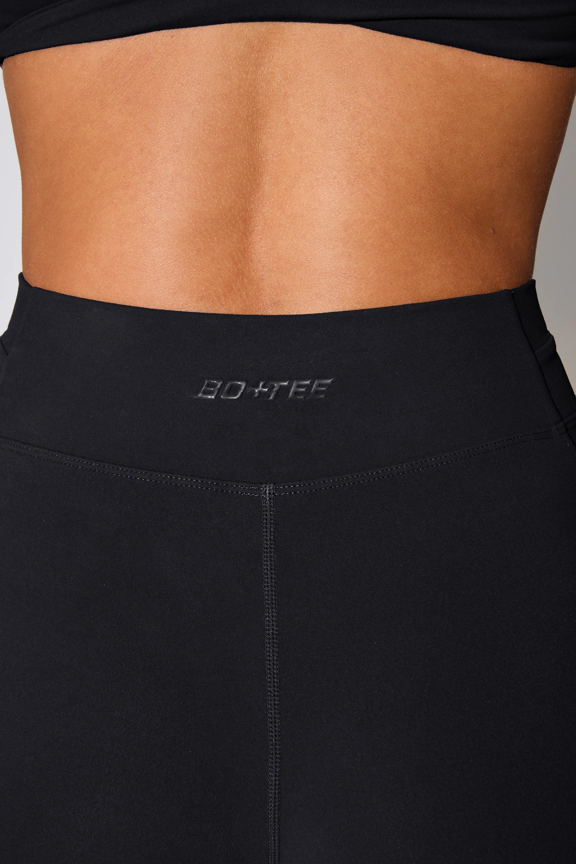 Petite Twist Waist Flare Leggings in Black sold by Oh Polly product image thumbnail 5