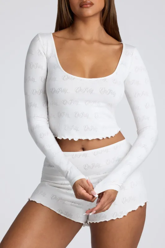 Long Sleeve Scoop Neck Pointelle Crop Top in White sold by Oh Polly