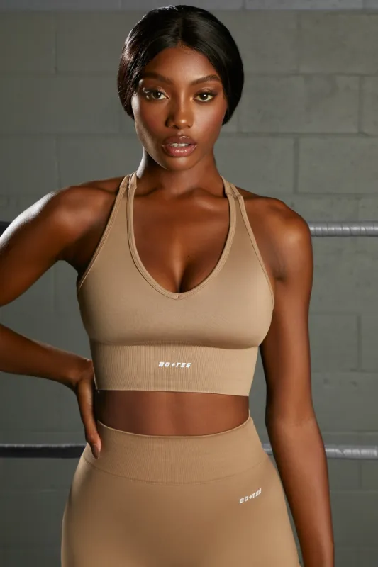 Overhaul Racer Knot Back Seamless Crop Top in Brown sold by Oh Polly