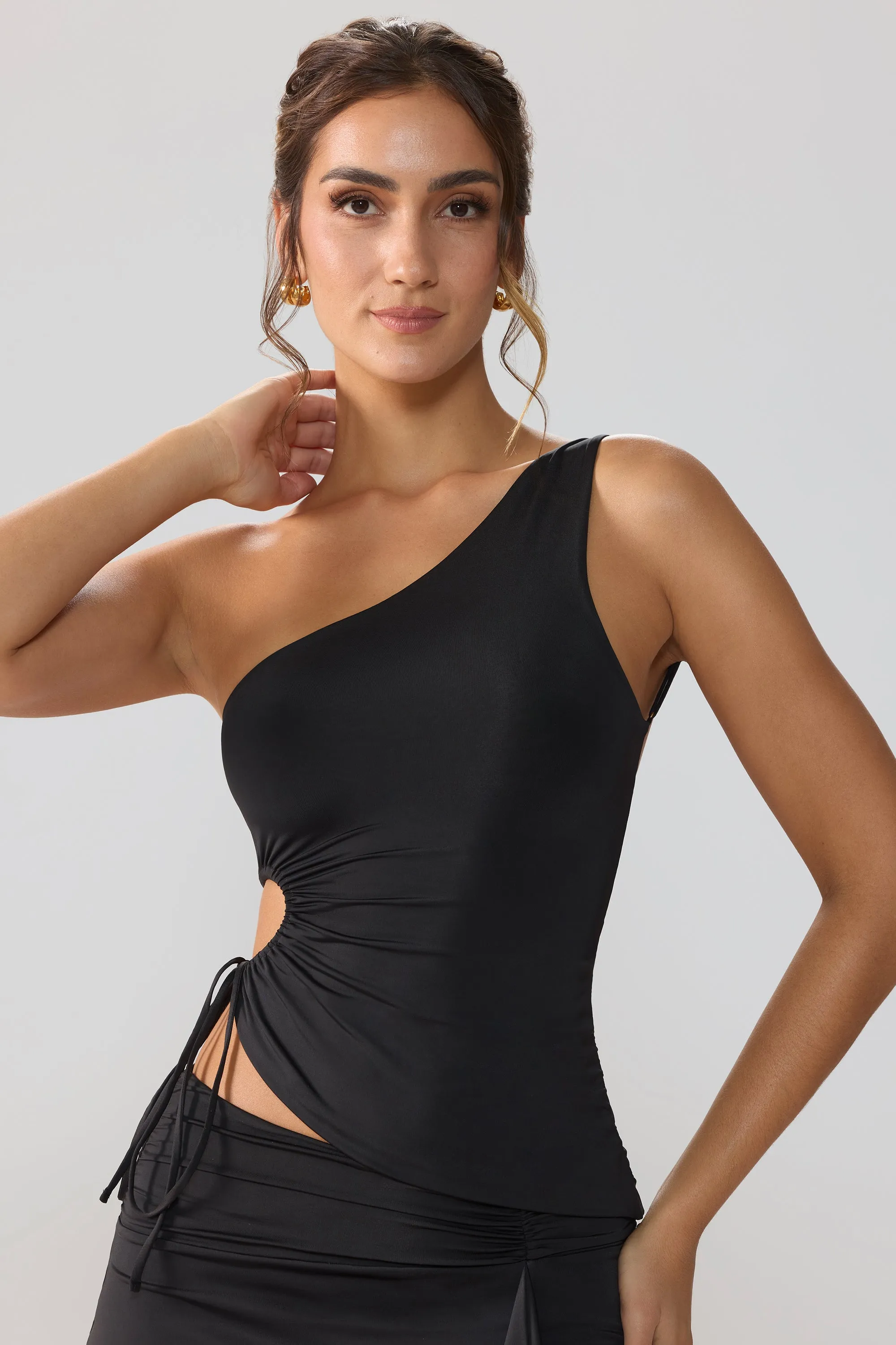 Slinky Jersey Ruched Cut Out One Shoulder Top in Black sold by Oh Polly