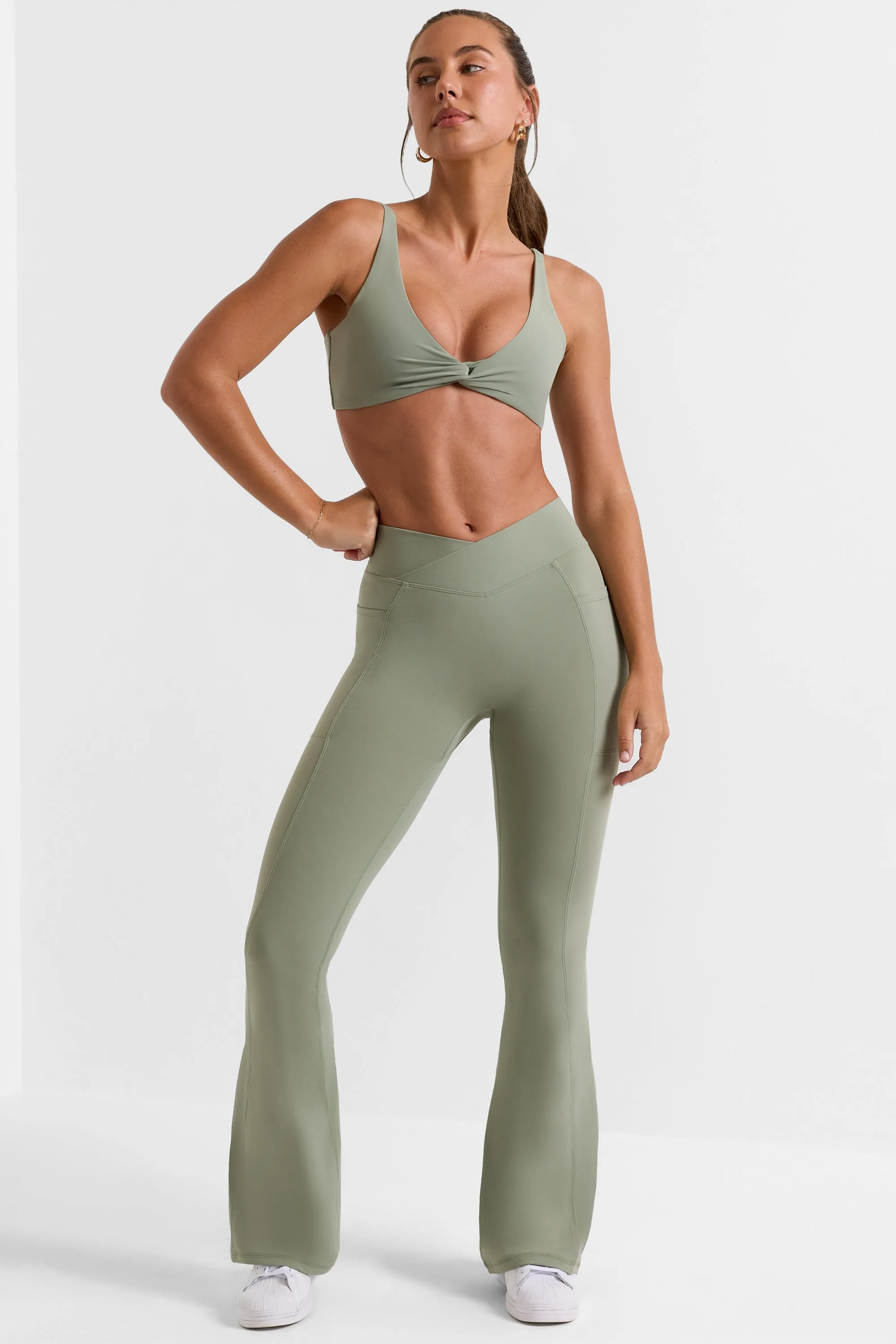 Petite Cross Waistband Flare Pocket Leggings in Bamboo Green sold by Oh Polly product image thumbnail 5