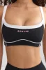 Soft Active Contrast-Trim Sports Bra in Black sold by Oh Polly