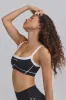 Soft Active Contrast-Trim Sports Bra in Black sold by Oh Polly