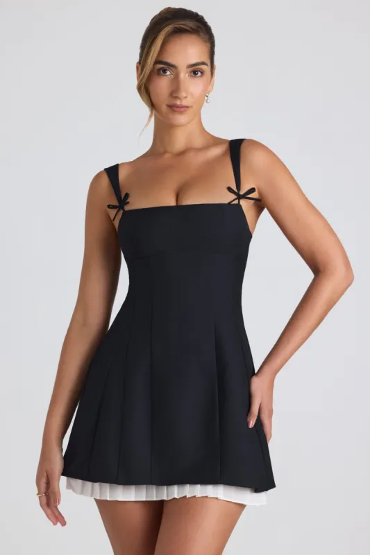 Bow-Detail Pleated A-Line Mini Dress in Black sold by Oh Polly
