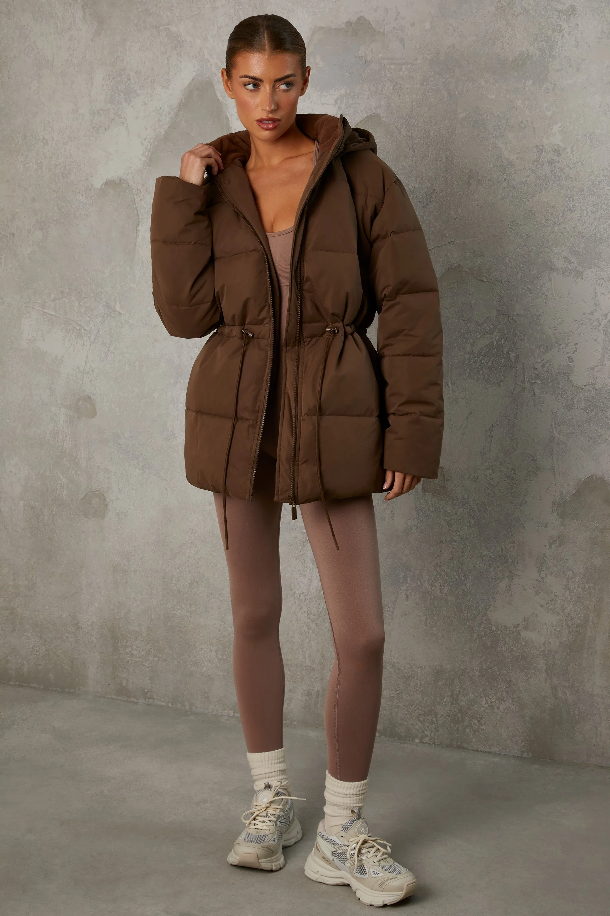 Mid Length Hooded Puffer Coat in Cocoa Brown sold by Oh Polly