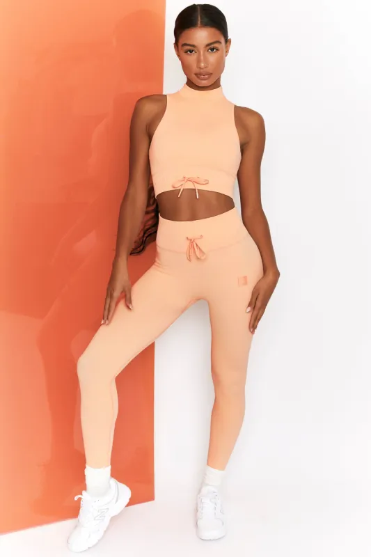 Energise Ribbed Tie Front Full Length Leggings in Peach sold by Oh Polly