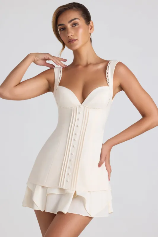 Ruffle-Trim Button-Detail Corset Mini Dress in Ivory sold by Oh Polly