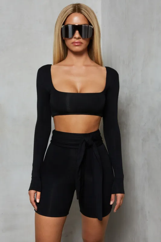 Shorty On The Side Long Sleeve Crop Top in Black sold by Oh Polly
