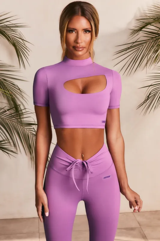 Power Up Slinky Cut Out High Neck Crop Top in Purple sold by Oh Polly