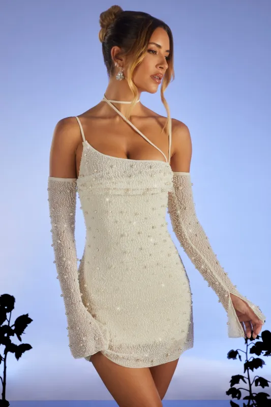 Embellished Asymmetric Corset Mini Dress in Ivory sold by Oh Polly