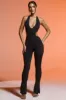 Petite Plunge Neck Cut Out Jumpsuit in Black sold by Oh Polly