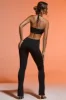 Petite Plunge Neck Cut Out Jumpsuit in Black sold by Oh Polly