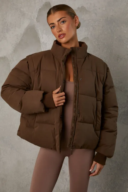 Cropped Puffer Jacket with Detachable Sleeves in Cocoa Brown sold by Oh Polly