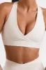 Cut Out Back Sports Bra in White sold by Oh Polly