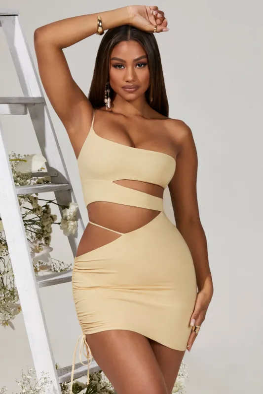 Side Cut Out Ruched Mini Dress in Cream sold by Oh Polly
