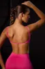 Super Sculpt Seamless Open Back Sports Bra in Fuchsia sold by Oh Polly