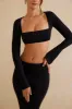 Long Sleeve Crop Top in Black sold by Oh Polly