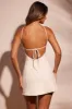 Cross Halter Neckline Low Back Mini Dress in White sold by Oh Polly