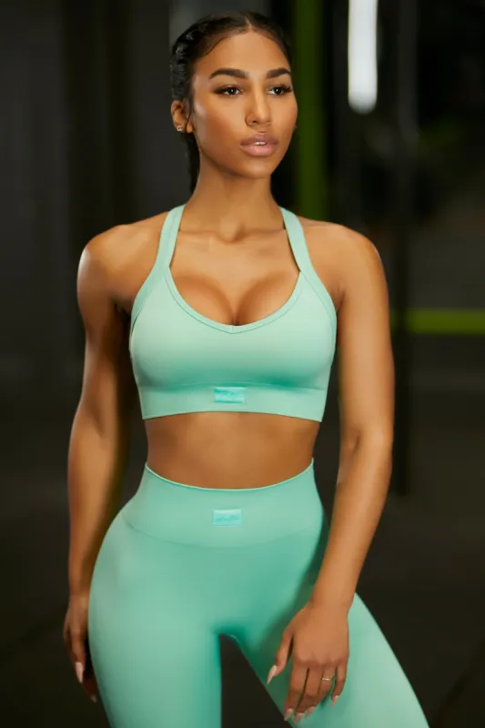 Cross Back Sports Bra in Turquoise sold by Oh Polly