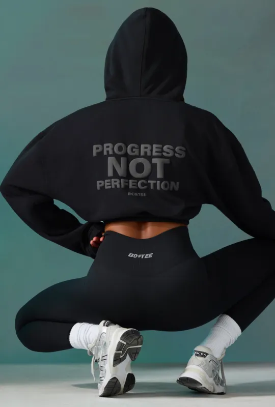 Cropped Drawstring Hooded Sweatshirt in Black sold by Oh Polly