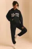 Petite Relaxed Fit Joggers in Black sold by Oh Polly