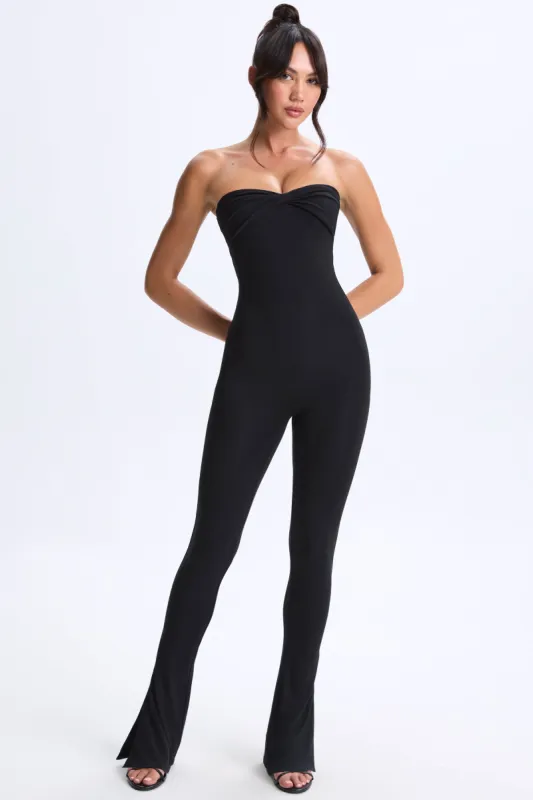 Petite Twist-Front Split Hem Flared Jumpsuit in Black sold by Oh Polly