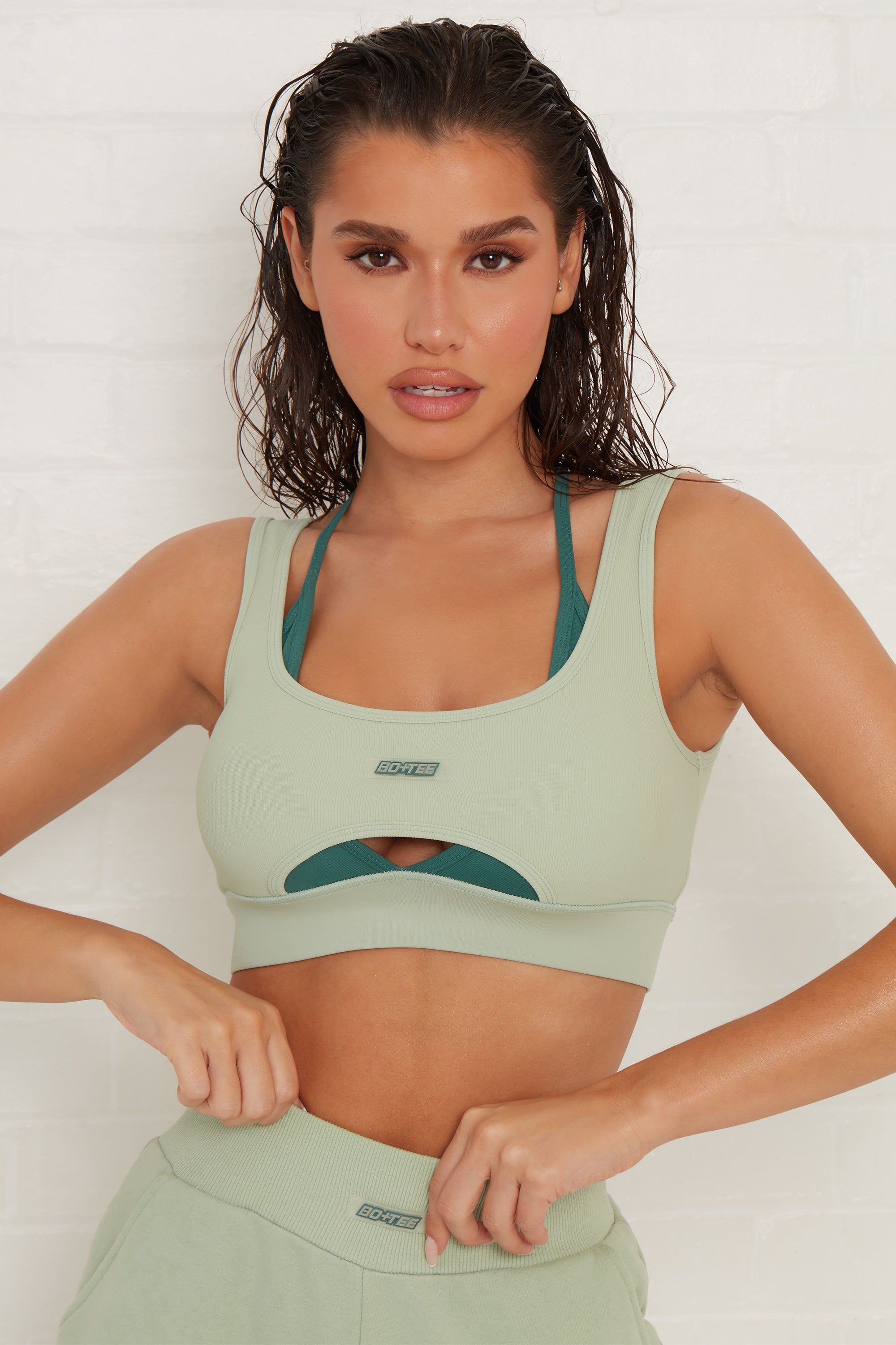 Ready Layered Cut Out Ribbed Sports Bra in Green sold by Oh Polly