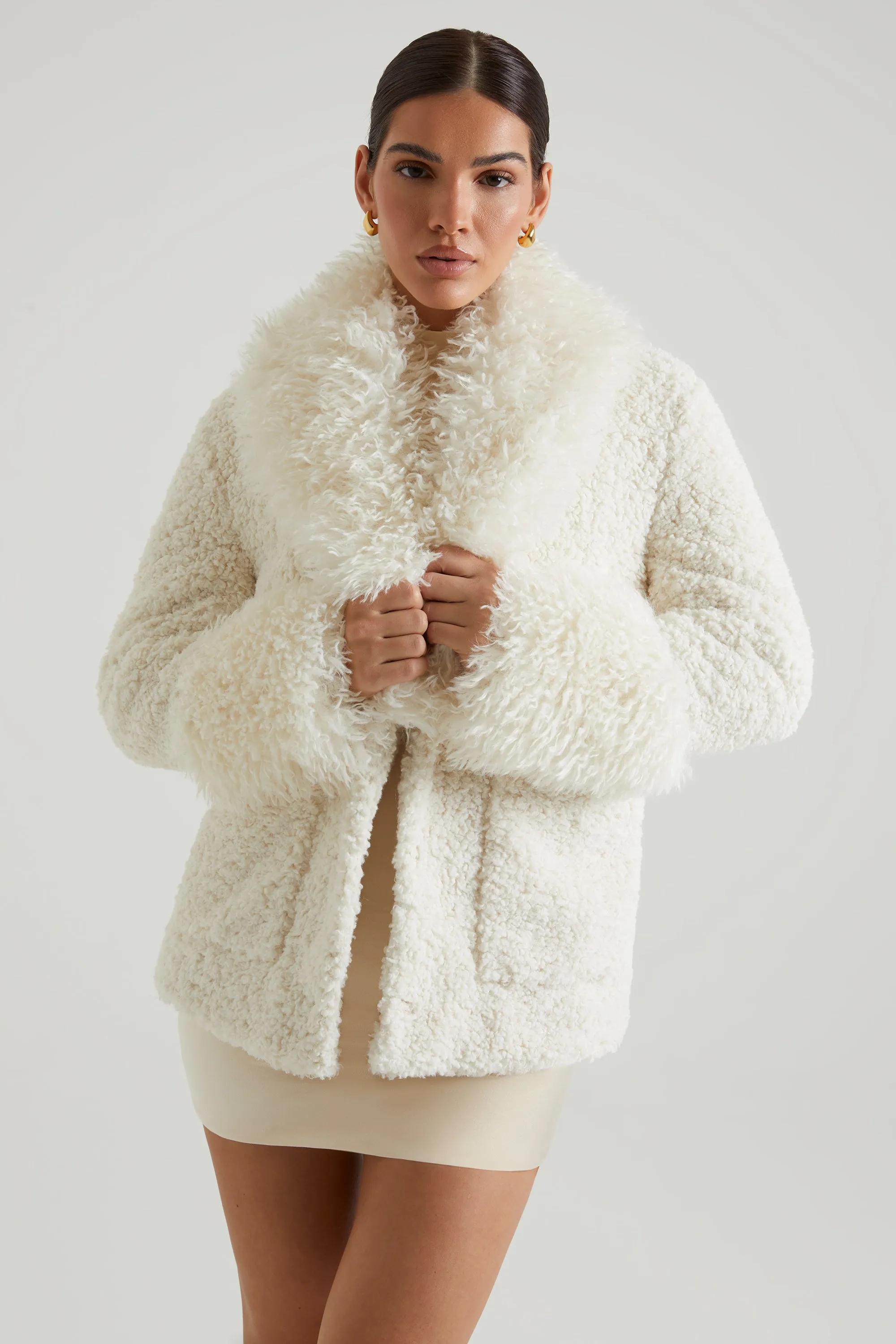 Shearling Coat with Large Front Pockets in Cream sold by Oh Polly