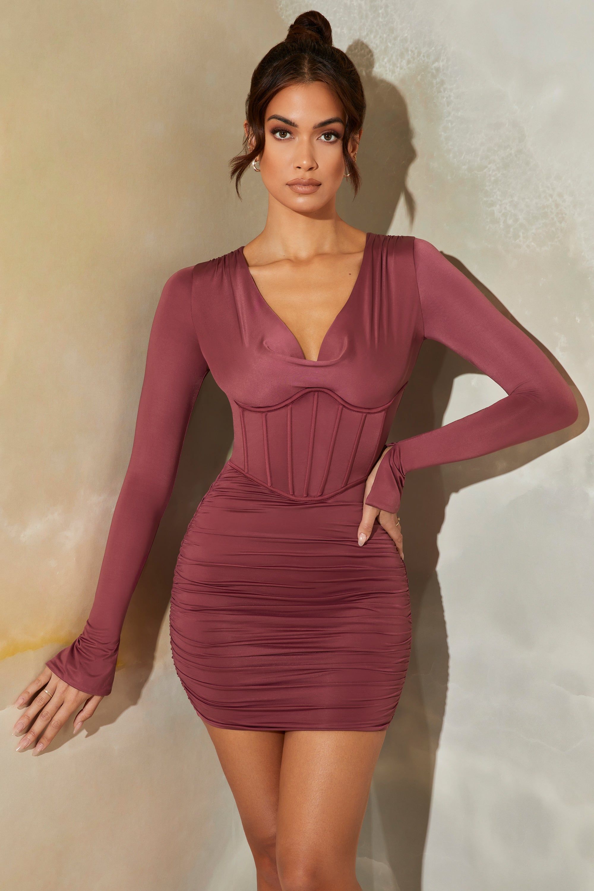Long Sleeve Cowl Neck Corset Mini Dress in Dark Mauve sold by Oh Polly