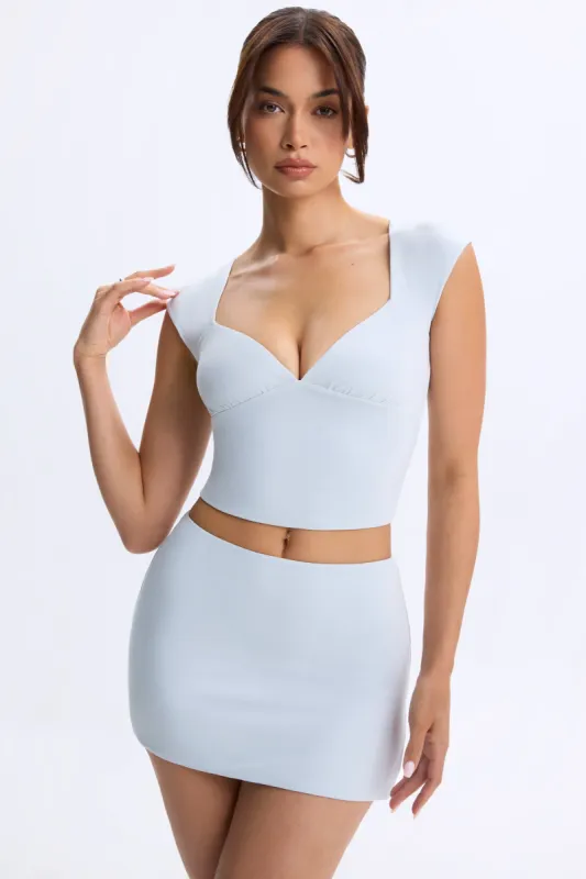 Mid-Rise Micro Mini Skirt in Dusty Blue sold by Oh Polly