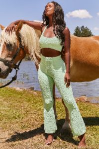 Petite Cosy Flared Leg Trousers in Green sold by Oh Polly