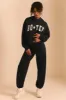 Relaxed Fit Joggers in Black sold by Oh Polly
