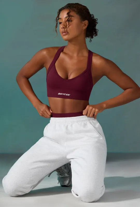 Super Sculpt Seamless Cross Back Sports Bra in Plum made by Bo + Tee