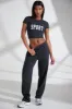Petite Wide Leg Embroidered Back Joggers in Black sold by Oh Polly