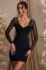 Long Sleeve Layered Corset Mini Dress in Black sold by Oh Polly