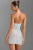 Embellished Halterneck Mini Dress in White sold by Oh Polly