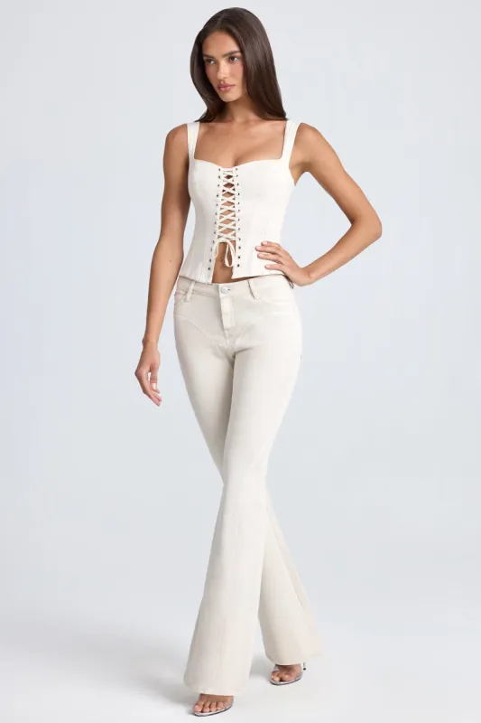 Mid-Rise Flared Jeans in Ecru sold by Oh Polly